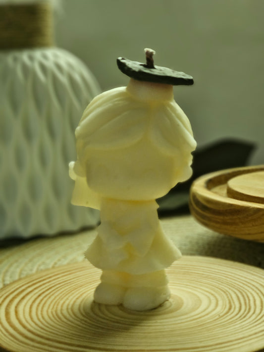 girl with graduation cap candle