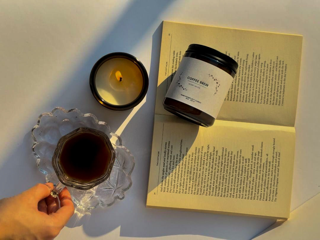 handmade candle, coffee and books